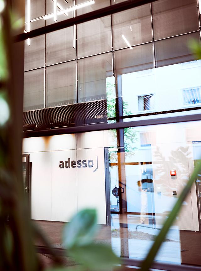 Wall with adesso logo